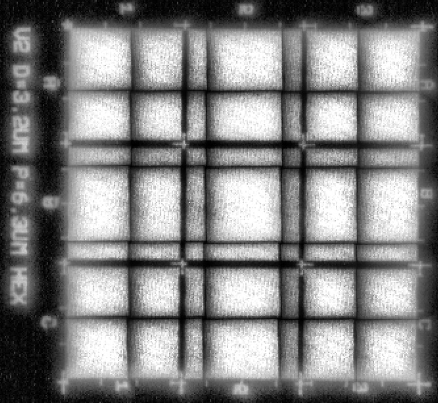 A small mosaic of well-array fields projected onto the camera sensor, with row and column labels