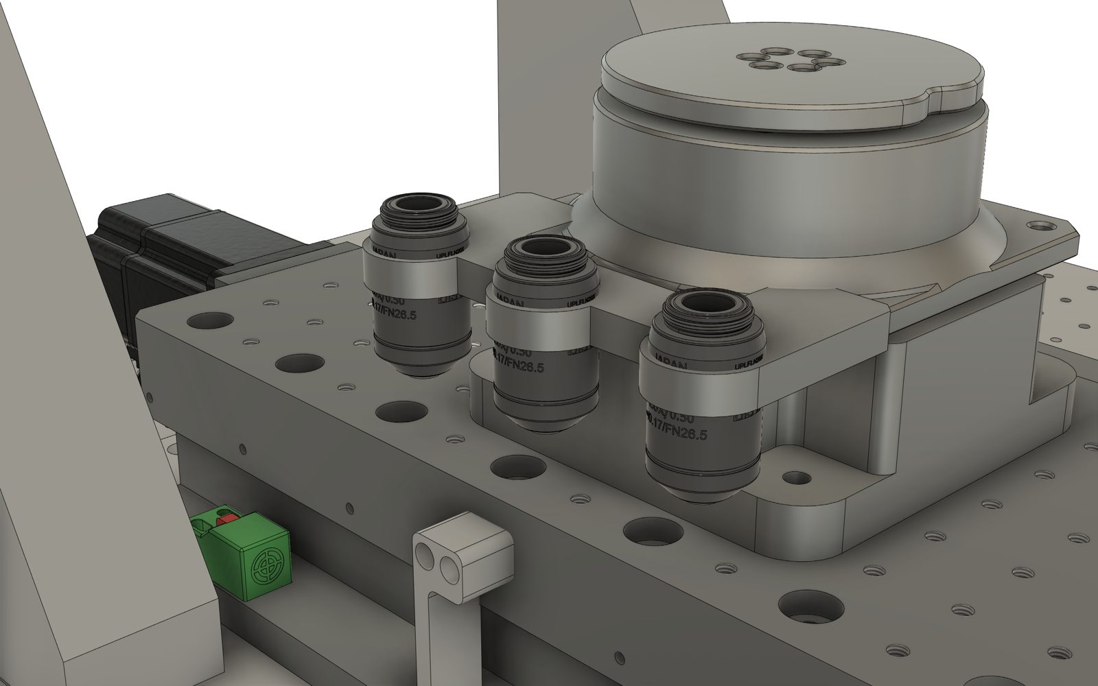 Objectives in a tool-rack, CNC style: 10× / 0.5 and 20× / 0.75.
