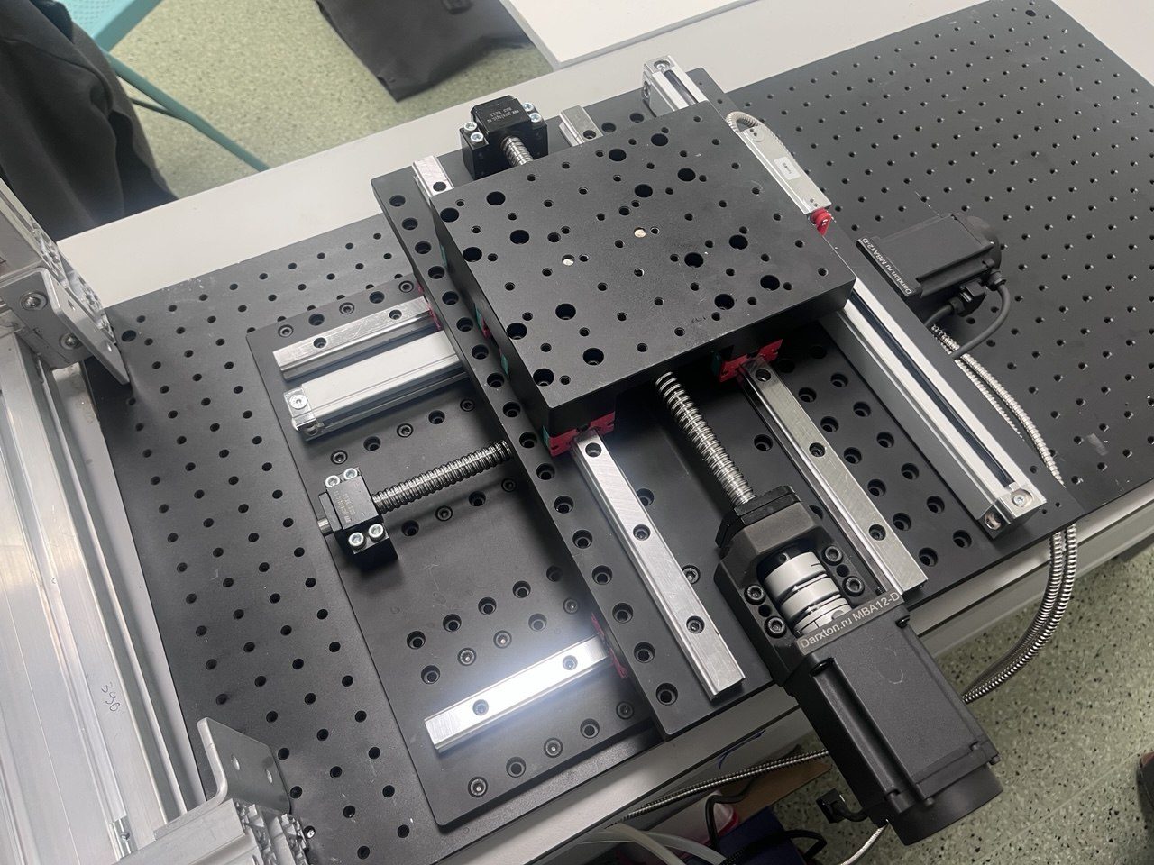 Servo drives and optical scales on both axes.